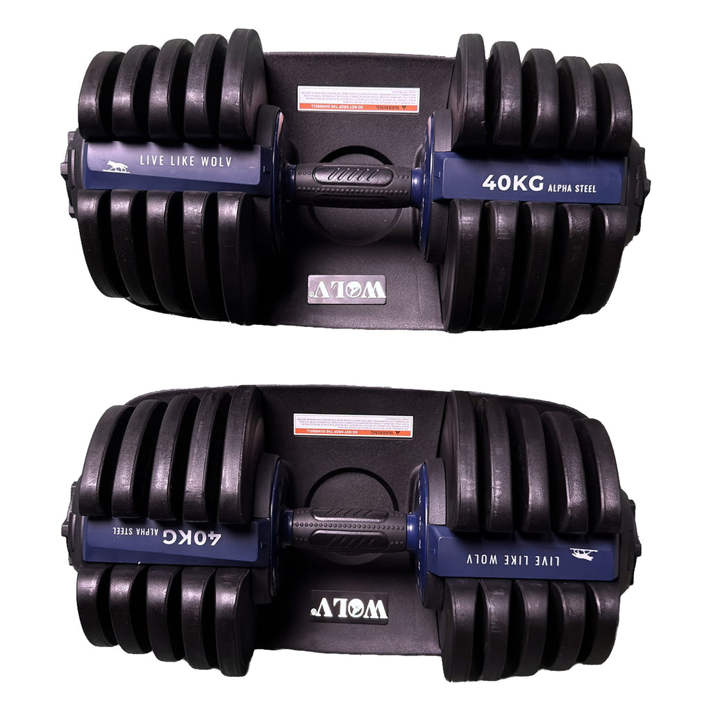 Mirrored side profiles of the WOLV dumbbell pair in trays with 40KG Alpha Steel branding